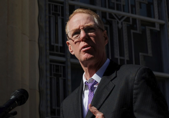 Attorney Paul Cassell speaks to reporters